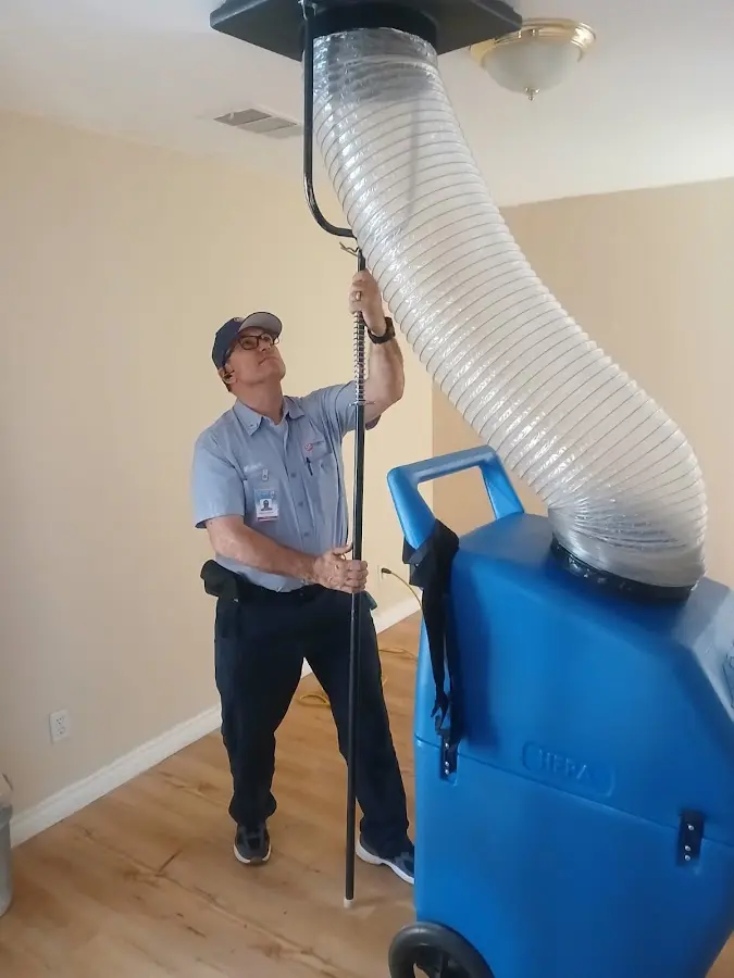 Furnace Tune-Up technician using HEPA equipment in Fort Wayne